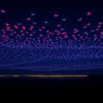 Drones create glowing shapes in Indonesia's night sky.