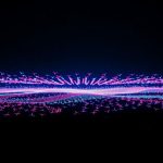 Dazzling drone light show over Bali at night.